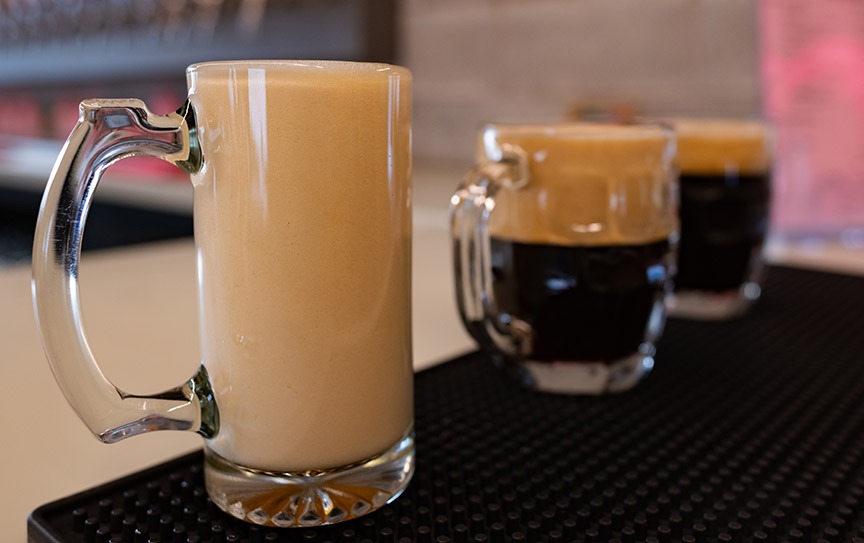 Three frothy glasses of Czech beer.