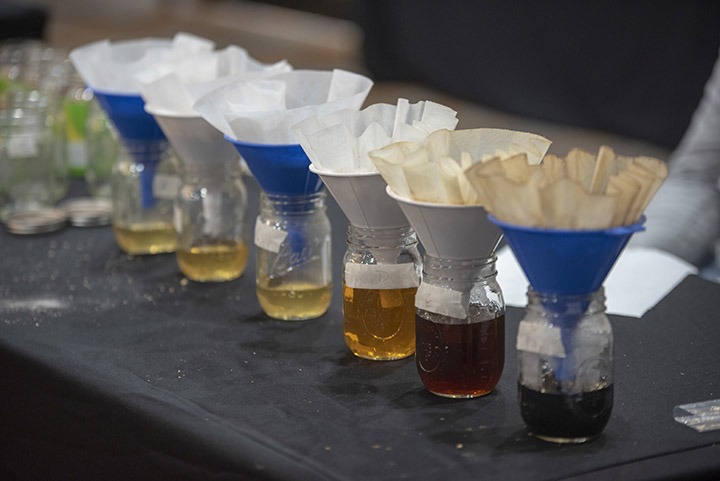 Jars with coffee filters and funnels filled with grain teas.